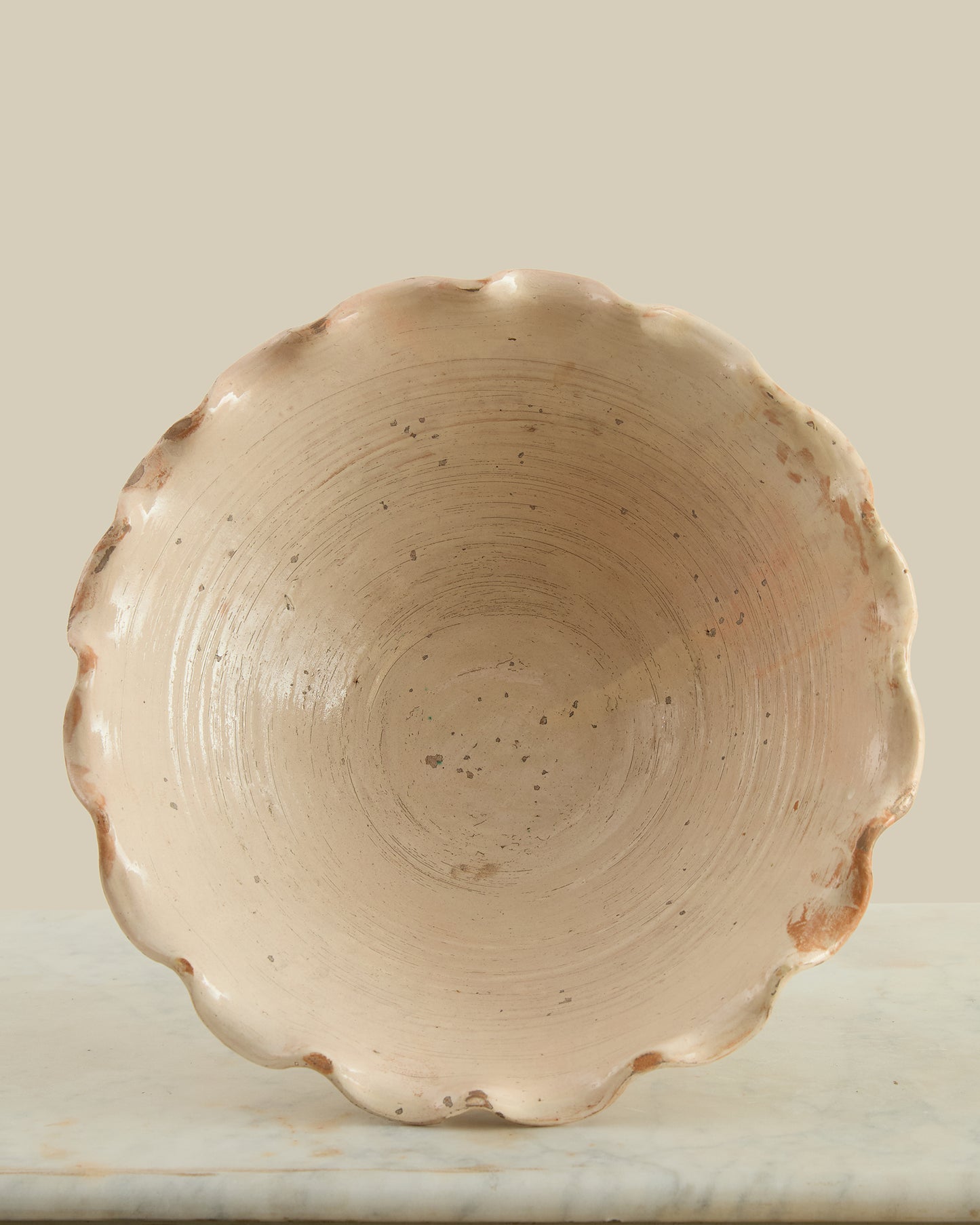 Scalloped pedestal fruit bowl