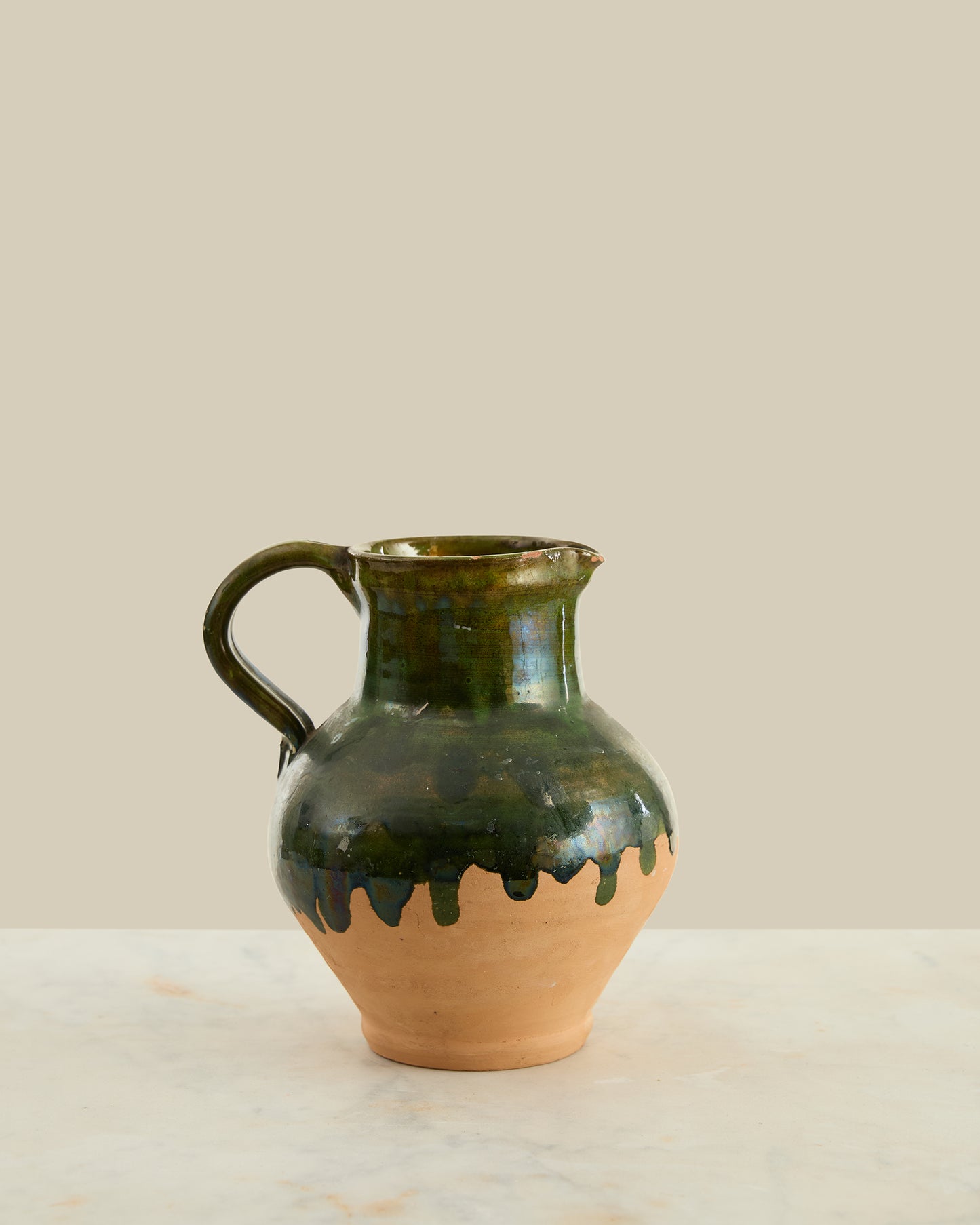 Green glazed terracotta pitcher
