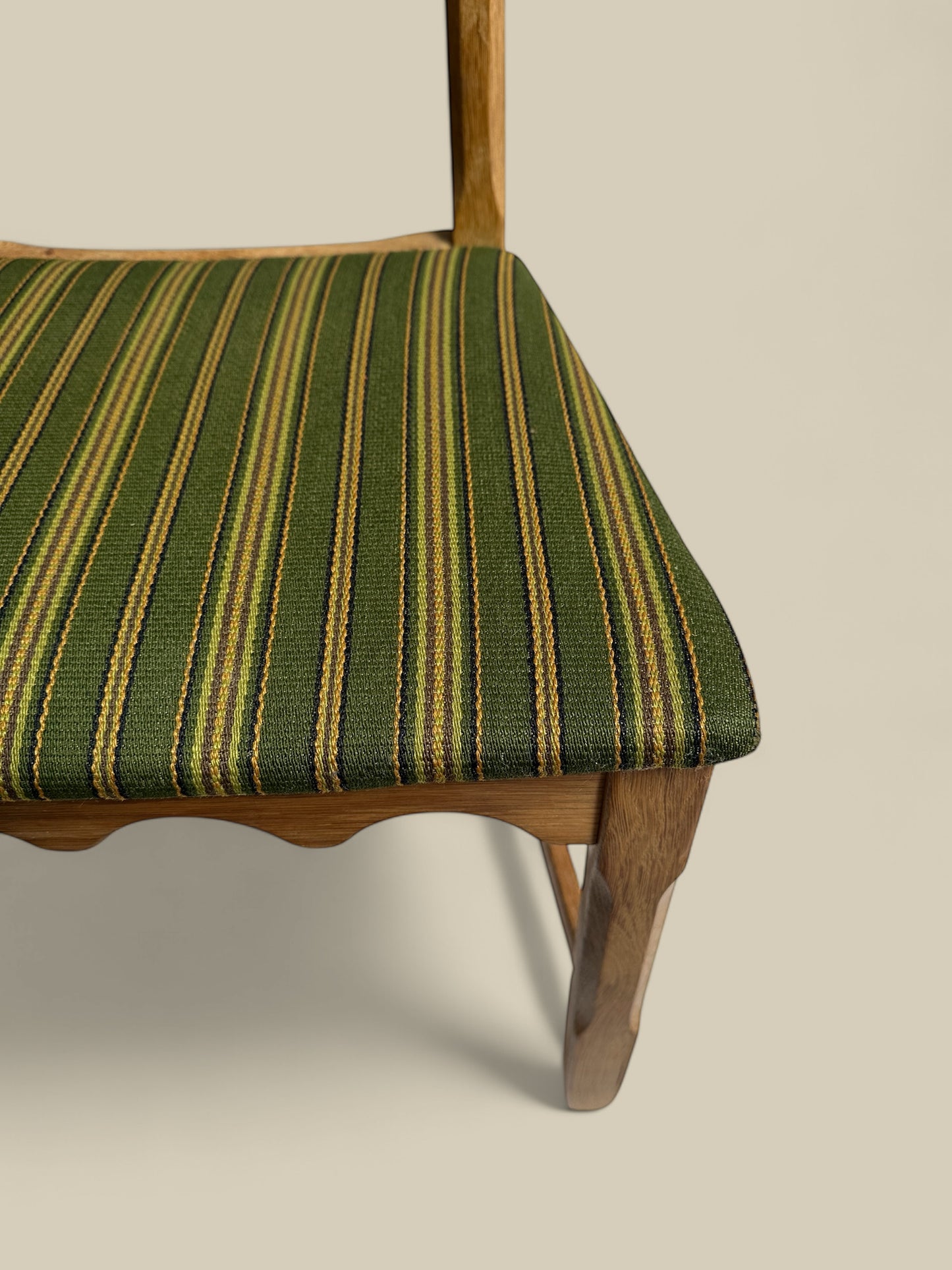 Pair of Henning Kjaernulf green uphosltery dining chairs