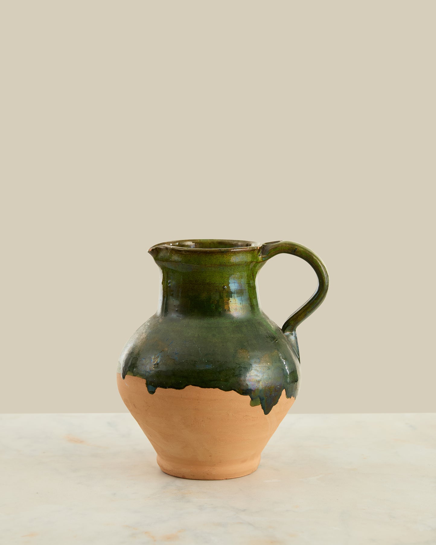 Green glazed terracotta pitcher