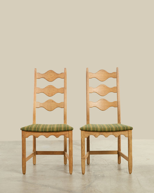 Pair of Henning Kjaernulf green uphosltery dining chairs