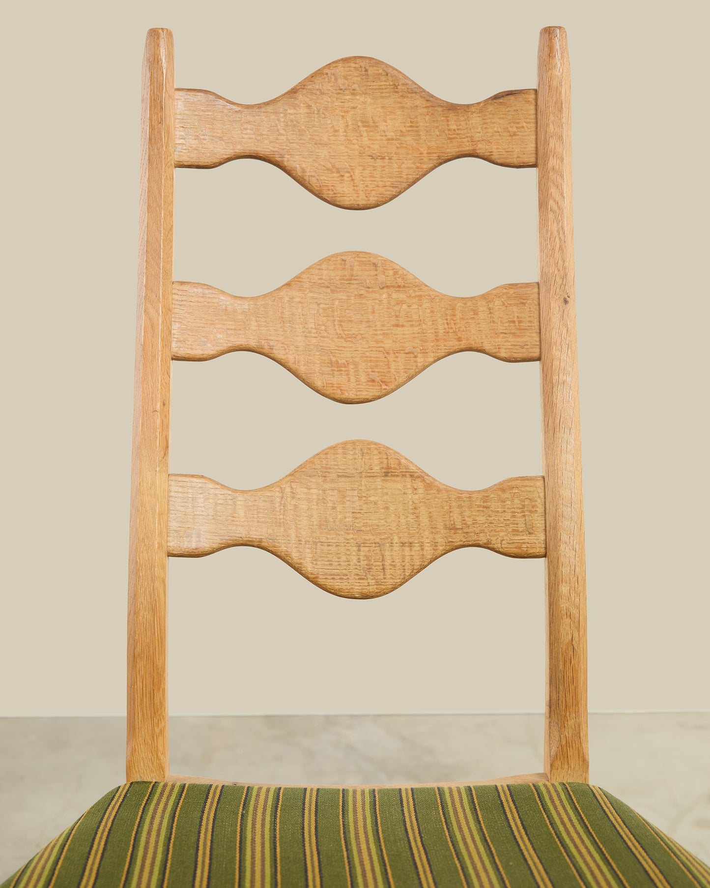 Pair of Henning Kjaernulf green uphosltery dining chairs