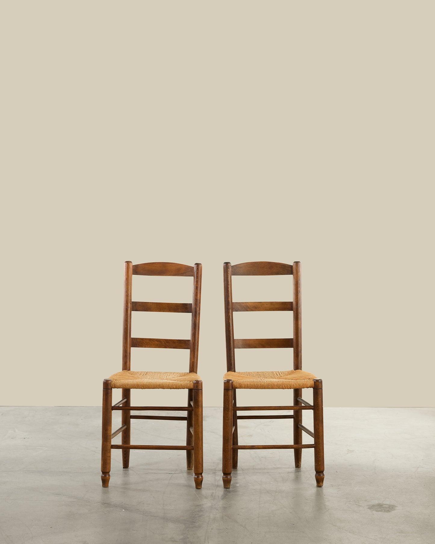 Pair of ladder back rush seat dining chairs