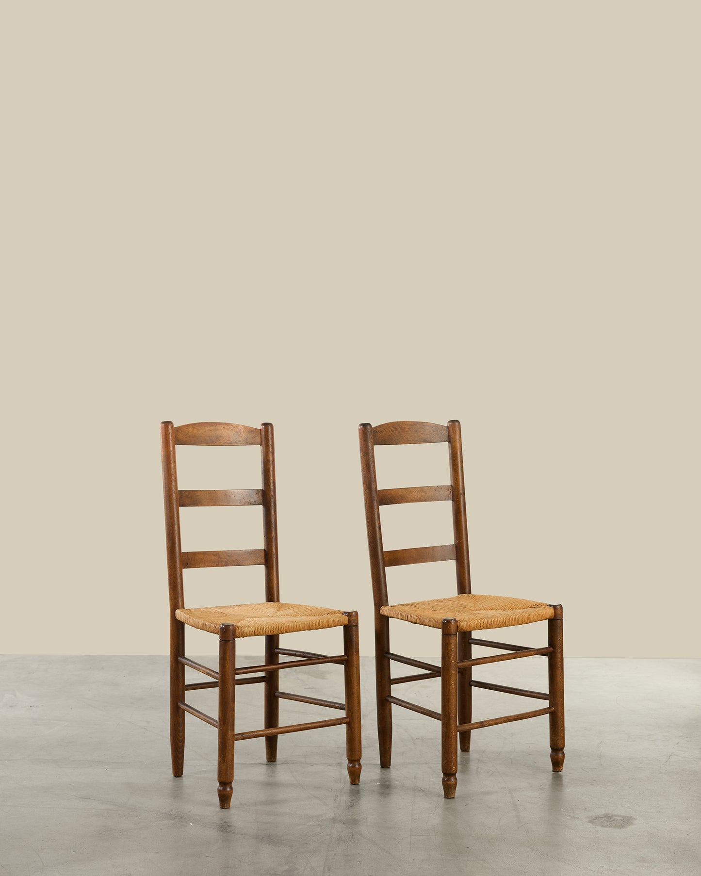 Pair of ladder back rush seat dining chairs