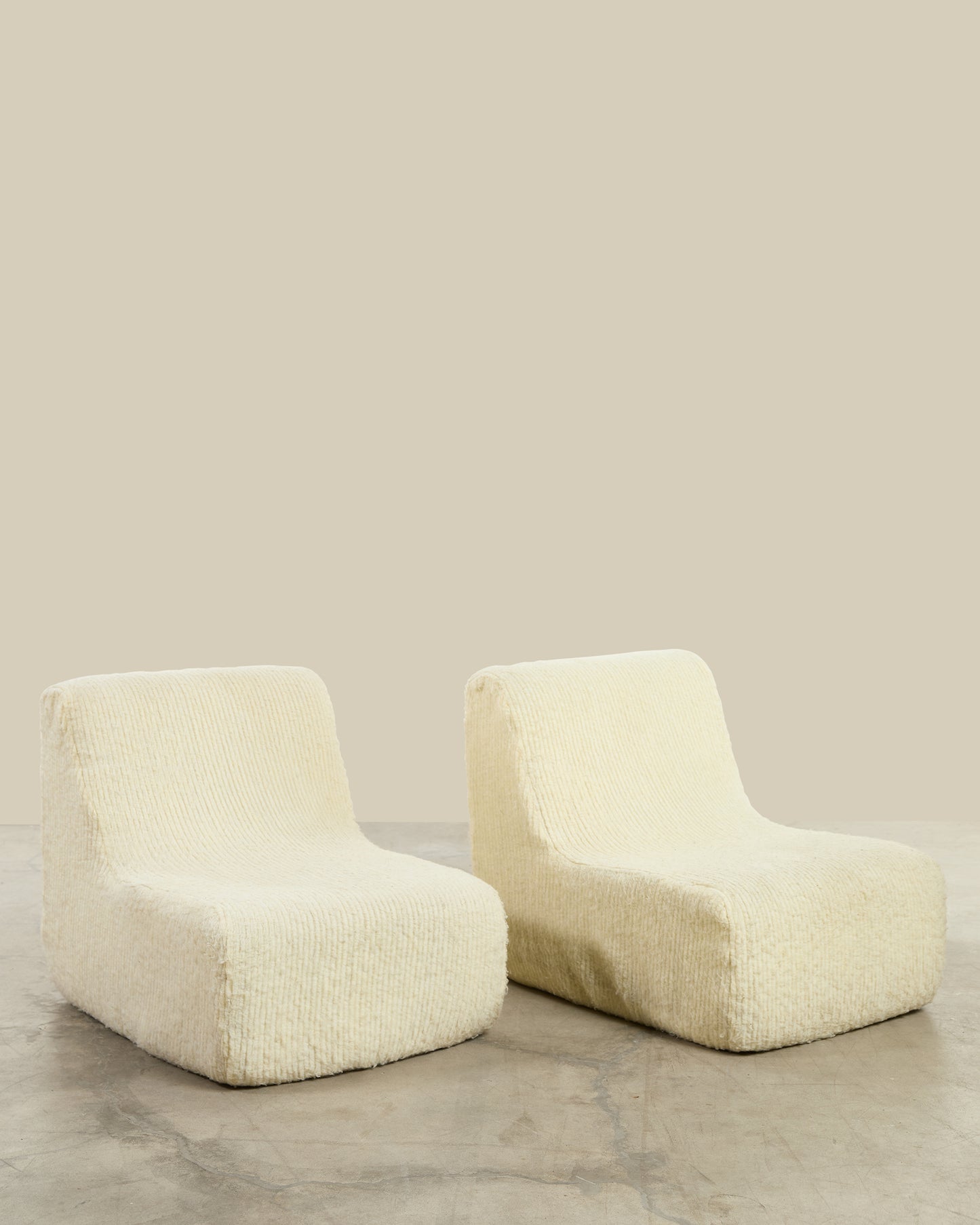Pair of cream Togo style chairs