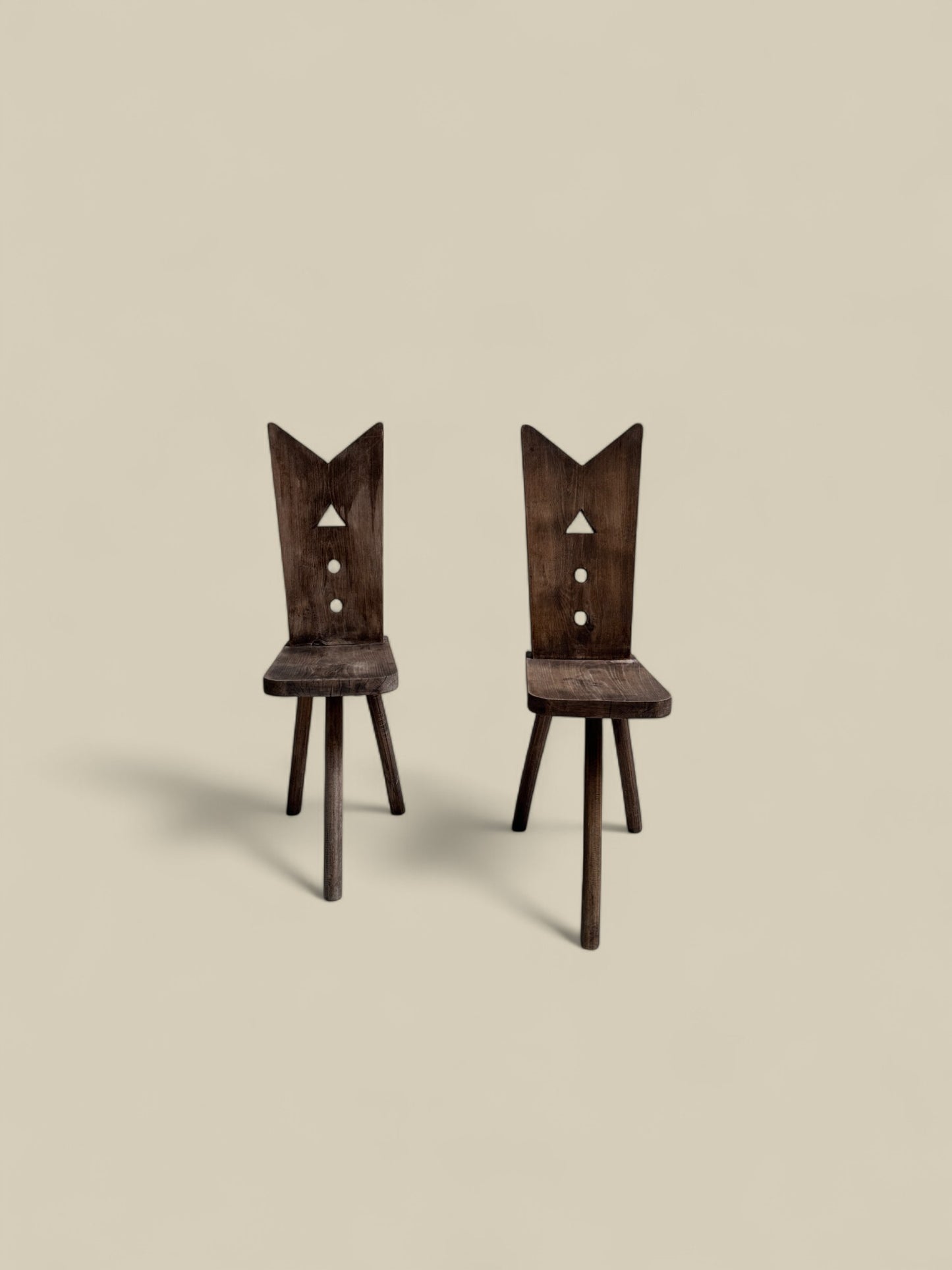 Pair of primitive 3 legged chairs