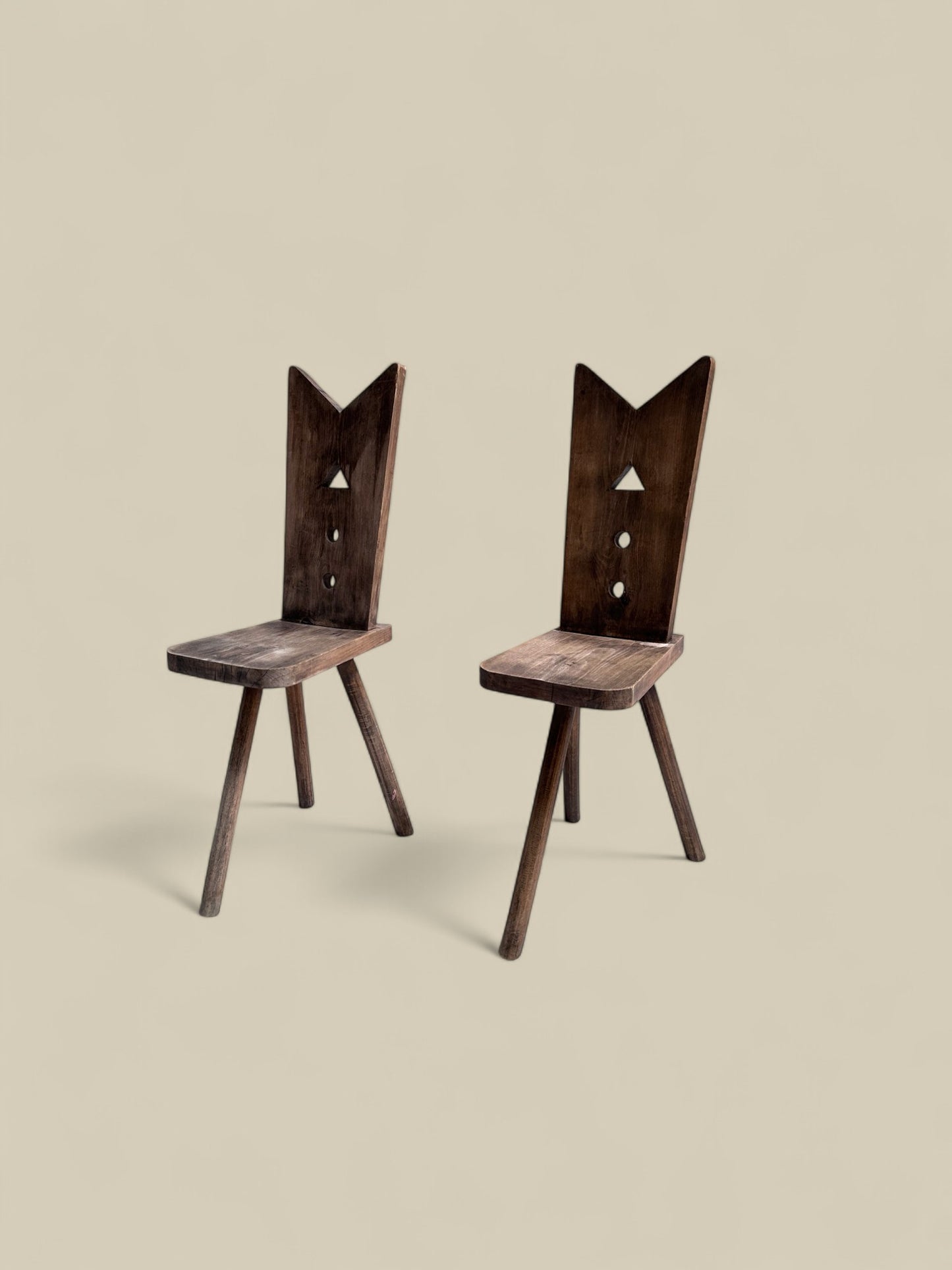 Pair of primitive 3 legged chairs