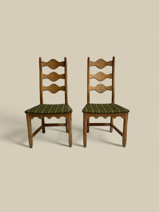 Pair of Henning Kjaernulf green uphosltery dining chairs