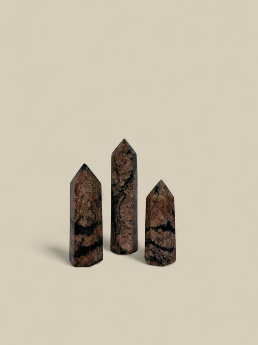 Set of red feldspar obelisk towers