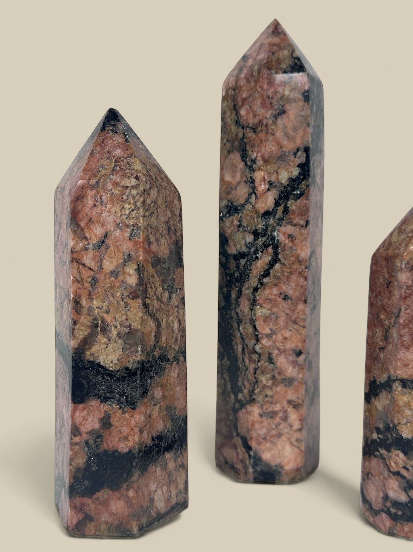 Set of red feldspar obelisk towers