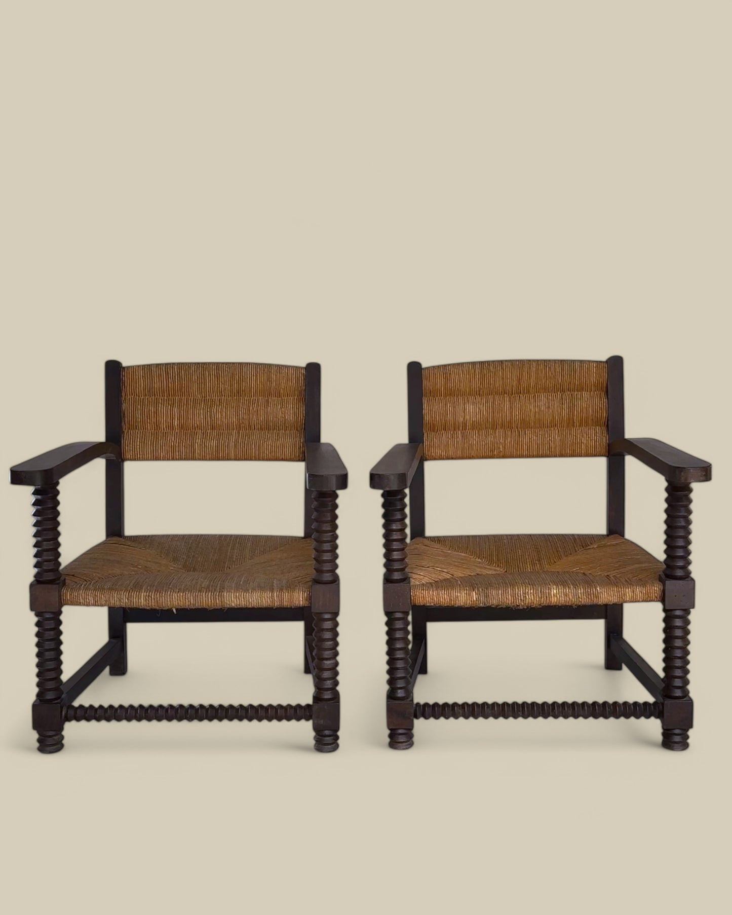 Pair of oak and woven rush arm chairs