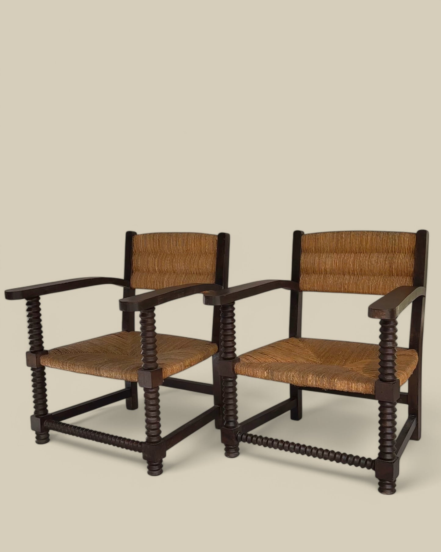 Pair of oak and woven rush arm chairs
